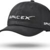 A black baseball cap with the SpaceX logo embroidered in white on the front and side.