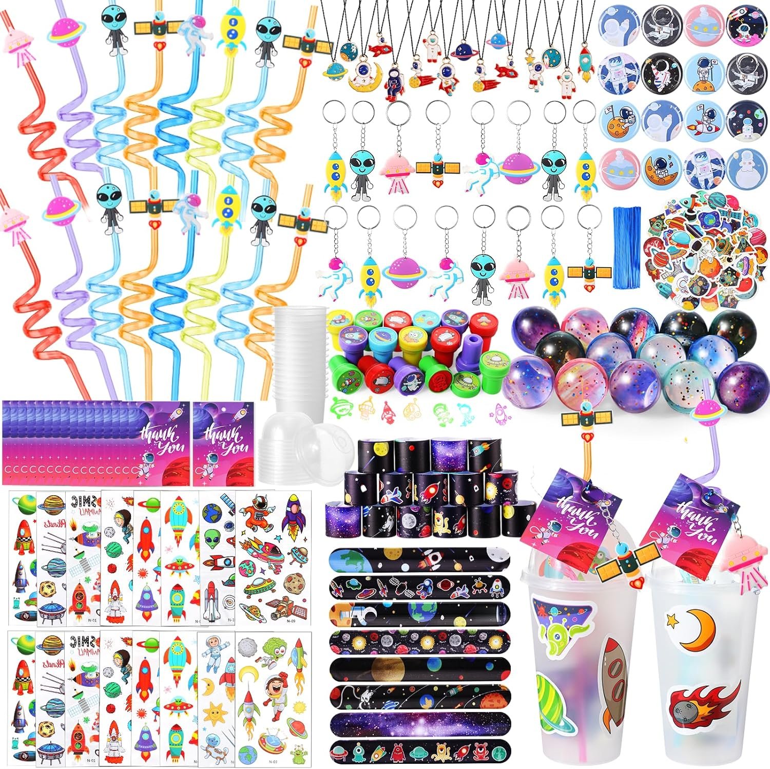 Assorted outer space-themed party favors including straws, keychains, stickers, bracelets, bouncy balls, stamps, and thank you cards arranged in rows.