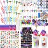 A variety of space-themed party favors including wavy straws, keychains, stickers, slap bracelets, stamps, cups, bouncy balls, and thank you cards arranged neatly.