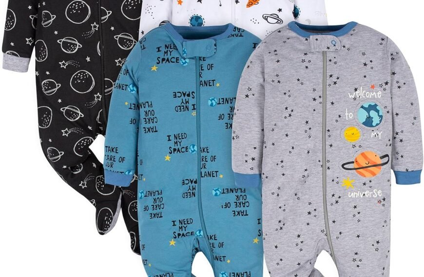 Four baby footed pajamas with space-themed designs, including planets, stars, and rockets, in black, white, blue, and gray colors.