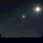 A person uses a telescope at night under a starry sky, observing a bright moon with a visible path traced between celestial bodies across the vast sky.